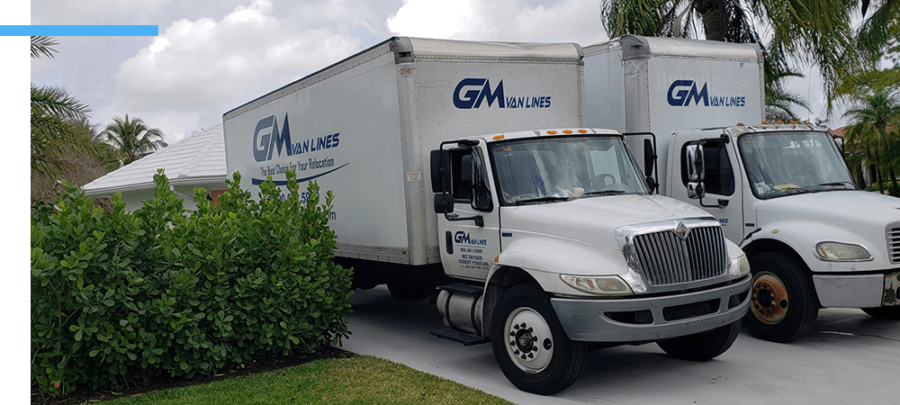 GM Van Lines trucks in driveway