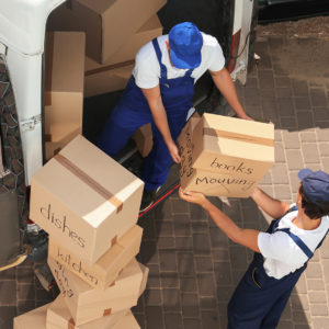 Image of men loading boxes into a truck