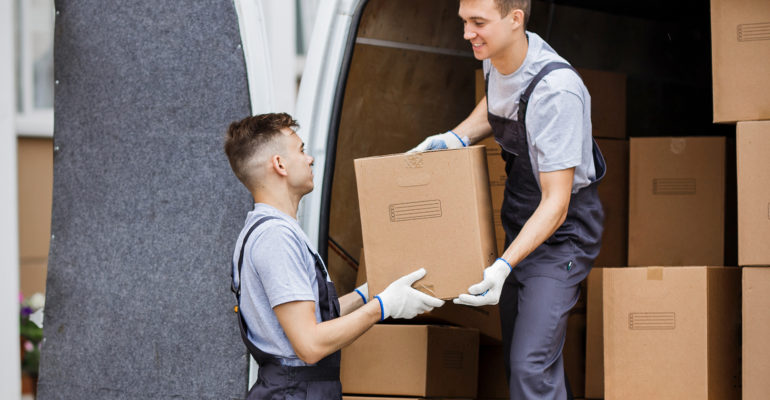 Image of men moving boxes in a van